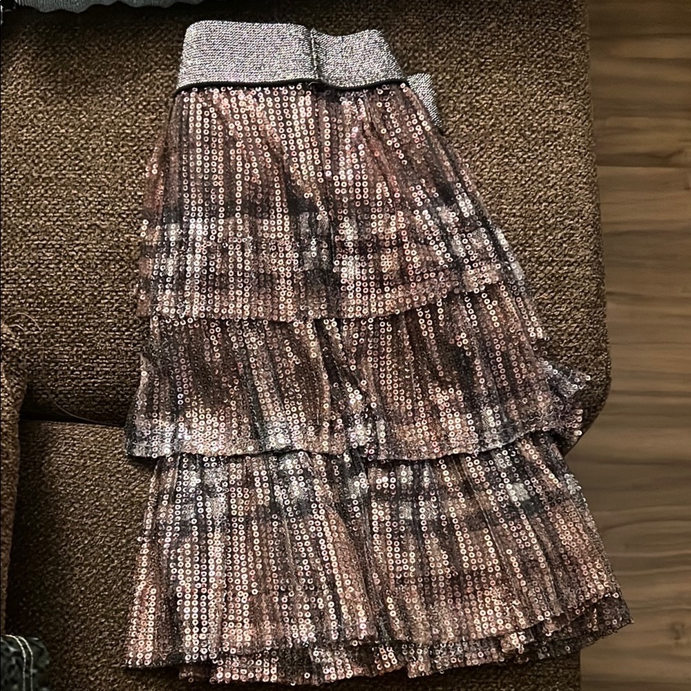 These playful mini skirts feat a charming bubble style w/ tiered ruffles + more
